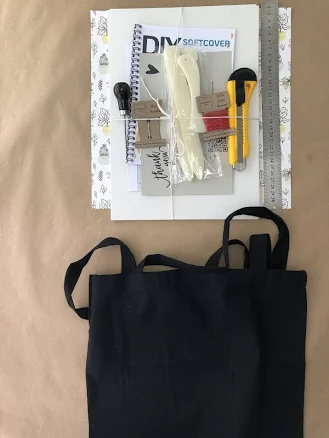 Linen keepsake album on a side table — Mother's Day gift for a grandmother, shoppable idea